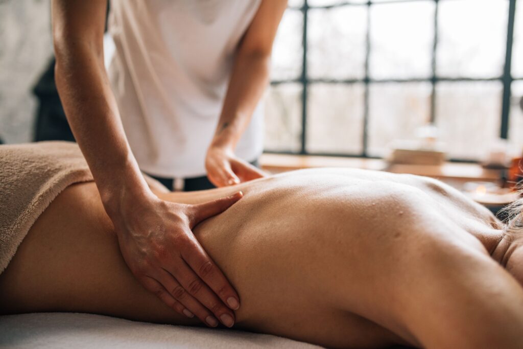 Experience relaxation with a full body massage in a serene indoor spa environment.